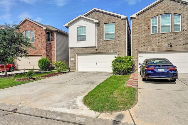 11417 Hackmatack Way, Houston, TX 77066 - view of front of house with concrete driveway, a garage, and brick siding