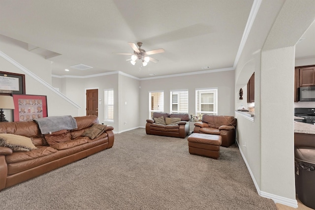 11417 Hackmatack Way, Houston, TX 77066 - living area featuring carpet, a ceiling fan, baseboards, ornamental molding, and stairway