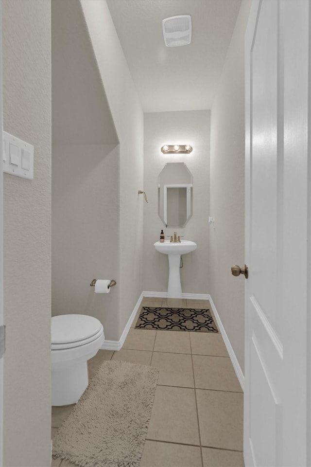11417 Hackmatack Way, Houston, TX 77066 - half bathroom featuring toilet, tile patterned floors, and baseboards