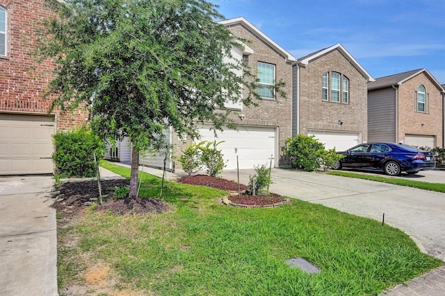 11417 Hackmatack Way, Houston, TX 77066 - view of front of home with brick siding, a garage, driveway, and a front lawn