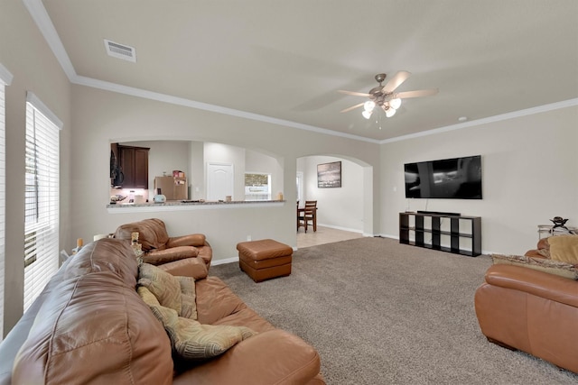 11417 Hackmatack Way, Houston, TX 77066 - living area featuring arched walkways, carpet, a ceiling fan, baseboards, and ornamental molding