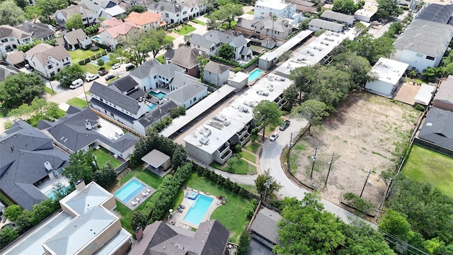 birds eye view of property with a residential view