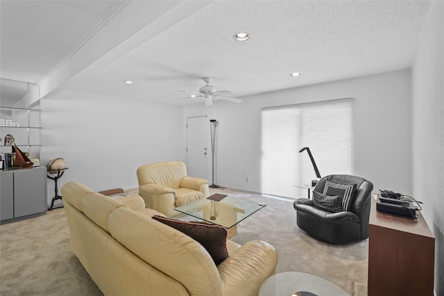 carpeted living room featuring ceiling fan, recessed lighting, and a textured ceiling