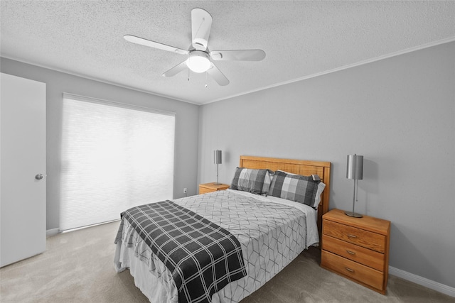 bedroom with baseboards, a textured ceiling, carpet, and ceiling fan
