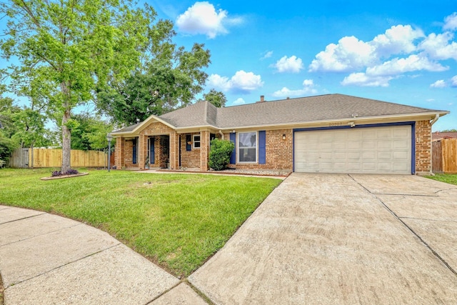 ranch-style home with fence, brick siding, a garage, a front yard, and concrete driveway