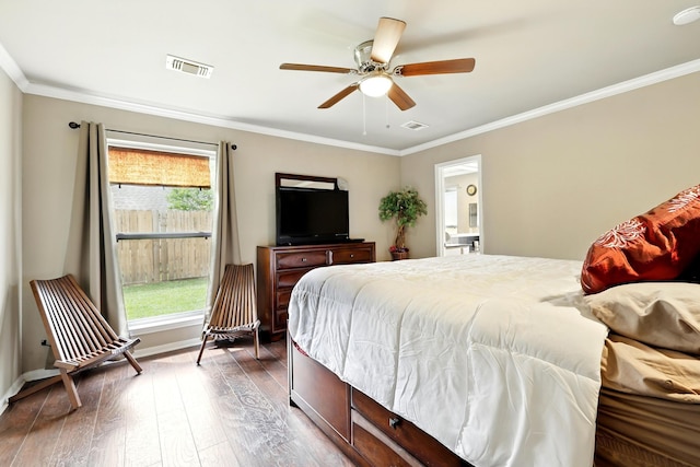 bedroom featuring crown molding, visible vents, multiple windows, and hardwood / wood-style flooring