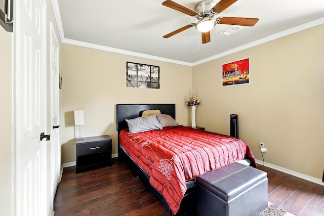 bedroom featuring crown molding, baseboards, hardwood / wood-style floors, and visible vents
