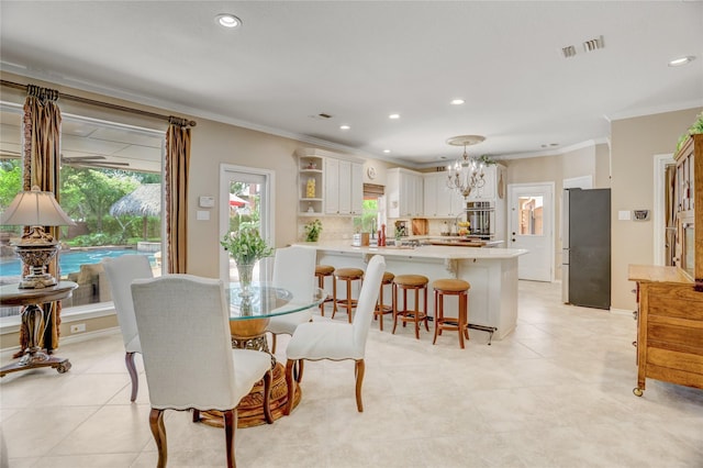 dining area featuring visible vents, recessed lighting, crown molding, and a chandelier