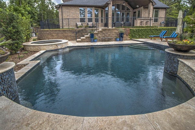 34119 Mill Creek Way, Pinehurst, TX 77362 - view of pool featuring a patio area, fence, and a pool with connected hot tub