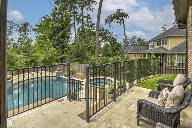 34119 Mill Creek Way, Pinehurst, TX 77362 - balcony with an in ground hot tub and a patio area