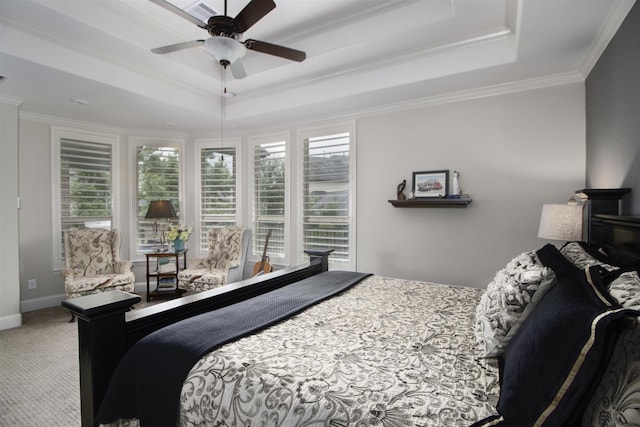34119 Mill Creek Way, Pinehurst, TX 77362 - carpeted bedroom featuring visible vents, ornamental molding, a tray ceiling, and multiple windows