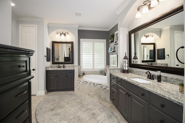 34119 Mill Creek Way, Pinehurst, TX 77362 - full bath with a garden tub, a sink, two vanities, and ornamental molding