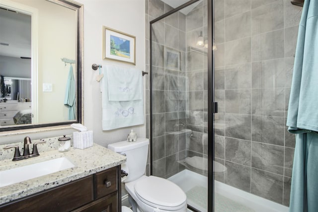 34119 Mill Creek Way, Pinehurst, TX 77362 - full bathroom featuring vanity, a stall shower, and toilet