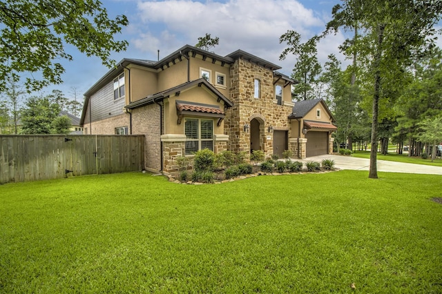 34119 Mill Creek Way, Pinehurst, TX 77362 - view of front of house with a front yard, driveway, and stone siding