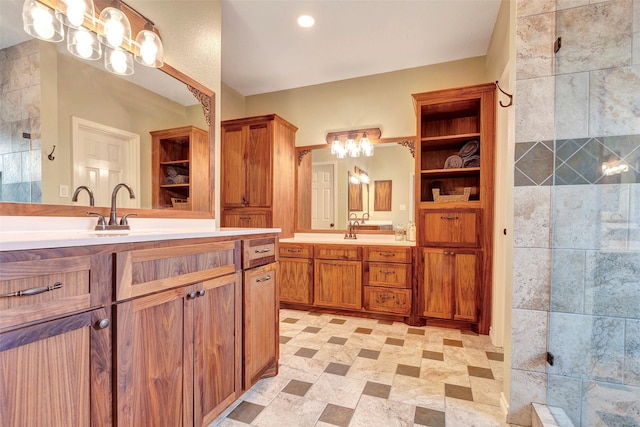 13722 Pear Woods Ct, Houston, TX 77059 - full bathroom featuring a tile shower, an inviting chandelier, two vanities, and a sink