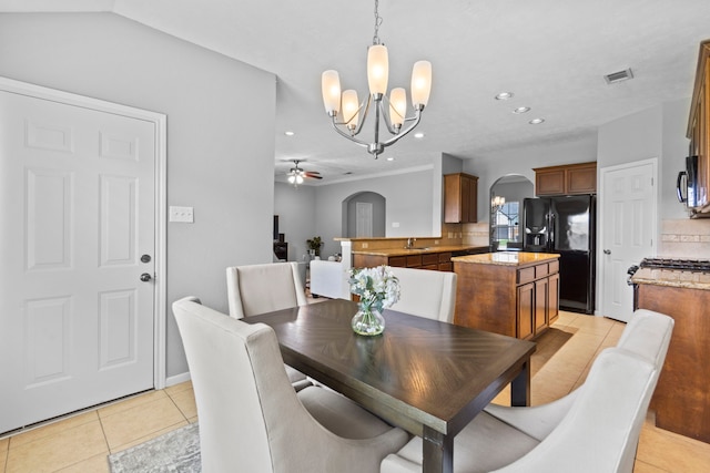 dining space featuring visible vents, arched walkways, light tile patterned floors, ceiling fan with notable chandelier, and recessed lighting