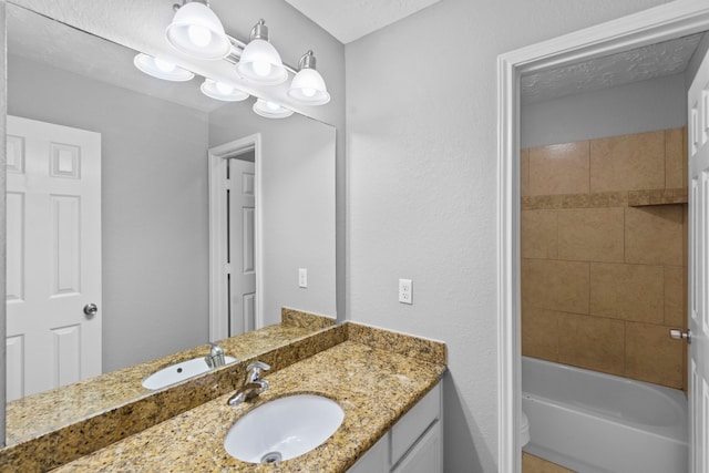full bathroom featuring vanity, toilet, and tub / shower combination