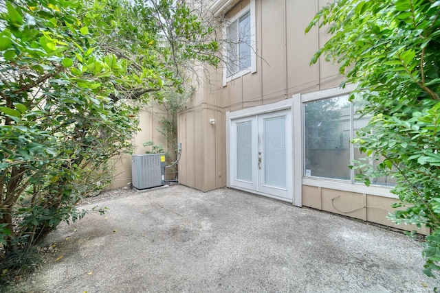 exterior space featuring central AC unit and french doors