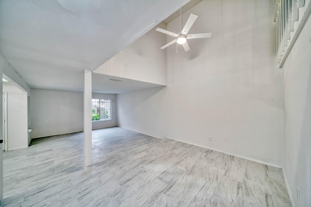 unfurnished living room with high vaulted ceiling, a ceiling fan, and visible vents