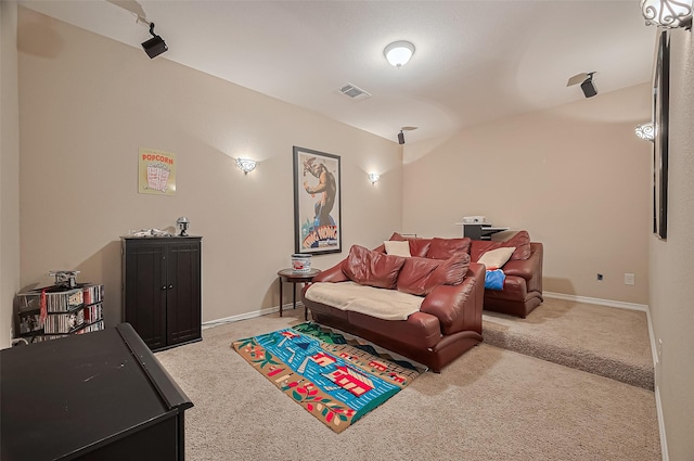 carpeted living area with visible vents and baseboards