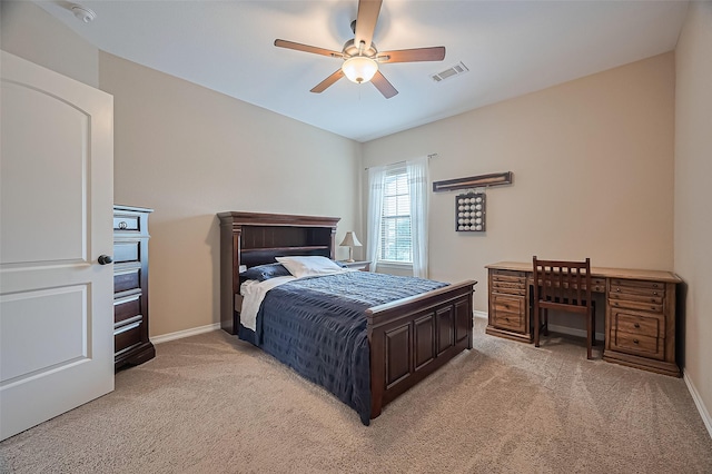 bedroom with a ceiling fan, baseboards, light colored carpet, and visible vents