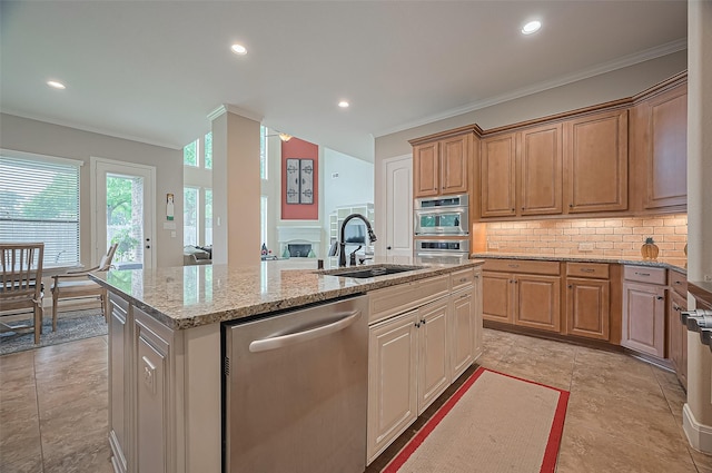 kitchen with crown molding, an island with sink, recessed lighting, a sink, and dishwasher