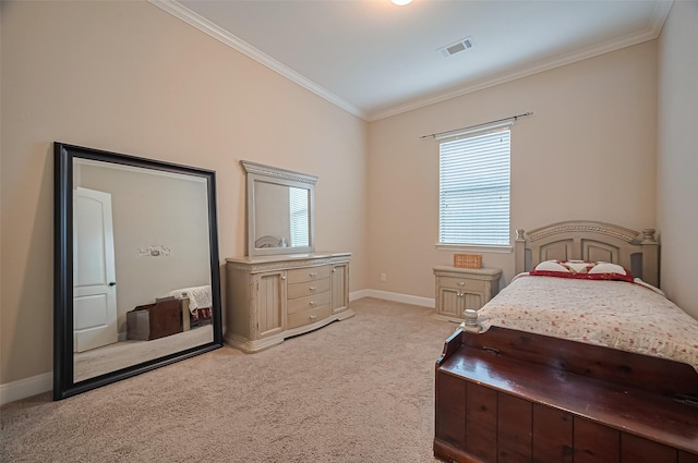 bedroom with crown molding, baseboards, visible vents, and light colored carpet