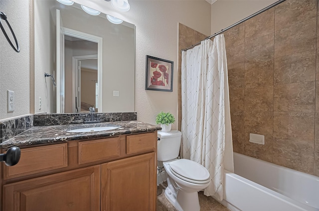 full bathroom featuring vanity, a textured wall, toilet, and shower / tub combo
