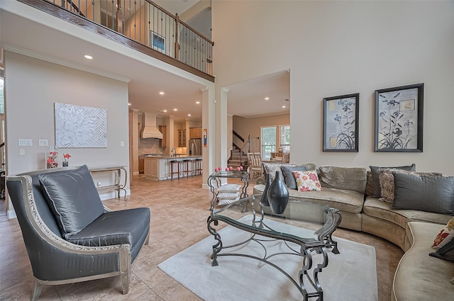 living room featuring recessed lighting, a high ceiling, light tile patterned floors, and stairway