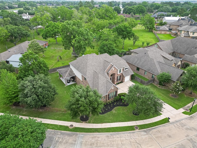 birds eye view of property with a residential view