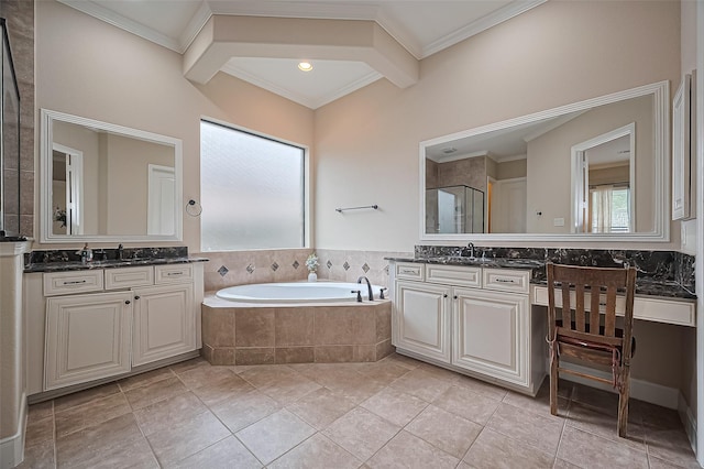 bathroom with a garden tub, a sink, two vanities, and ornamental molding