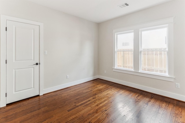 1026 Fugate St, Houston, TX 77009 - empty room with baseboards and dark wood-style flooring