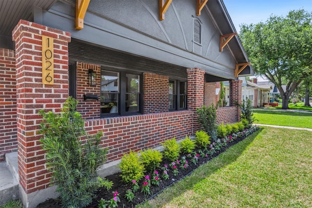 1026 Fugate St, Houston, TX 77009 - view of side of home featuring brick siding and a yard
