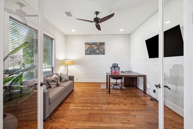 office area featuring visible vents, light wood-style floors, ceiling fan, and french doors