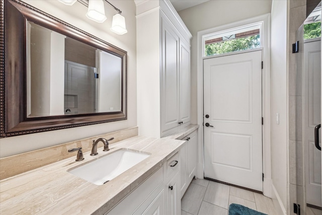 bathroom with vanity and tile patterned flooring