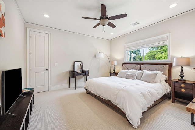 bedroom featuring baseboards, light colored carpet, recessed lighting, and visible vents