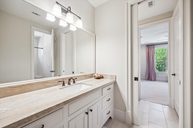 bathroom with visible vents, tile patterned flooring, and vanity