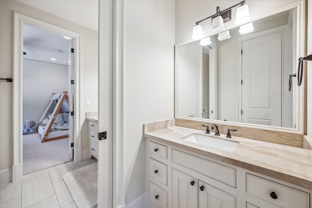 bathroom featuring connected bathroom and vanity