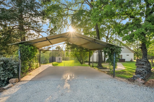 view of car parking featuring driveway and a detached carport