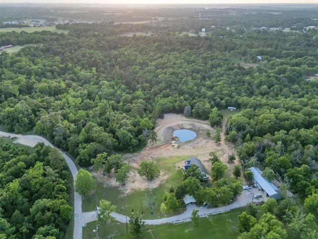 drone / aerial view featuring a view of trees