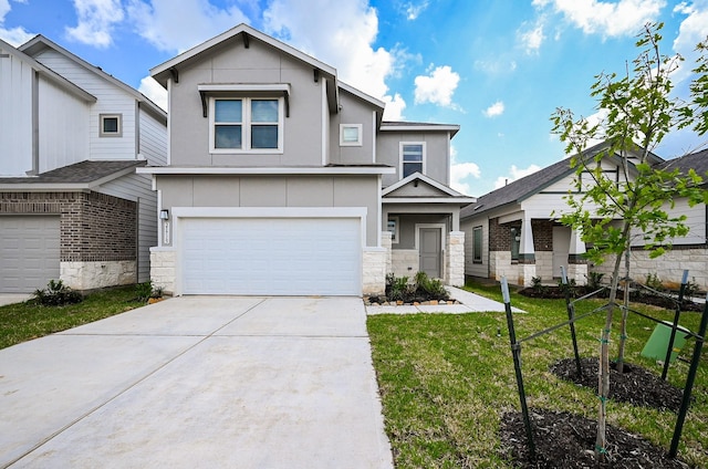 view of front of home featuring an attached garage, a front lawn, driveway, and stone siding