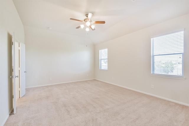 9135 Monarch Field Ln, Cypress, TX 77433 - spare room featuring baseboards, a ceiling fan, vaulted ceiling, and light carpet
