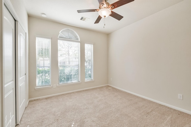 9135 Monarch Field Ln, Cypress, TX 77433 - empty room featuring carpet flooring, baseboards, visible vents, and ceiling fan