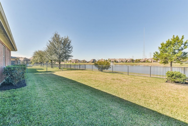 9135 Monarch Field Ln, Cypress, TX 77433 - view of yard with a water view, a fenced backyard, and a residential view