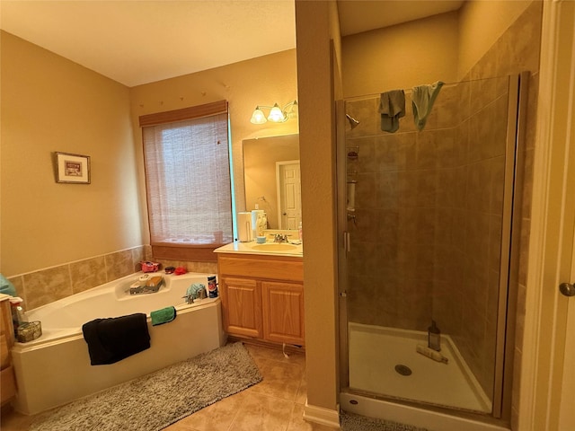 8813 Lauren Ln, Waller, TX 77484 - bathroom featuring a bath, a shower stall, tile patterned flooring, and vanity