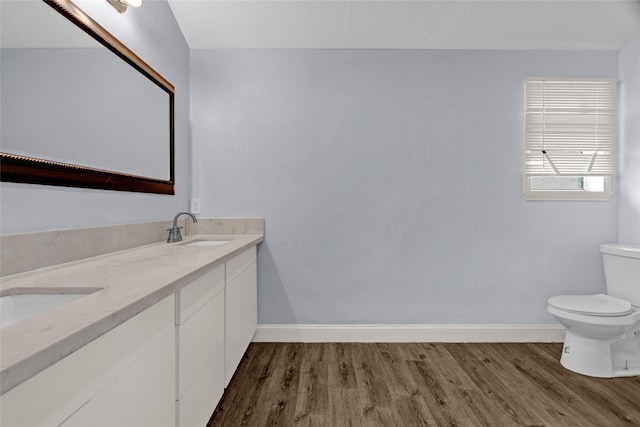 331 Terminal St, Houston, TX 77020 - bathroom featuring baseboards, a sink, wood finished floors, and toilet