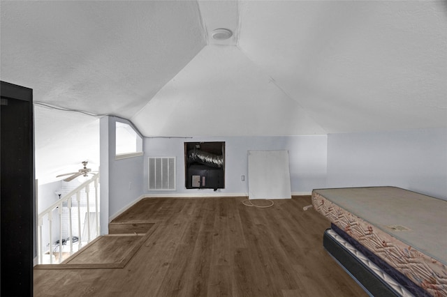 331 Terminal St, Houston, TX 77020 - additional living space with visible vents, lofted ceiling, wood finished floors, baseboards, and a ceiling fan