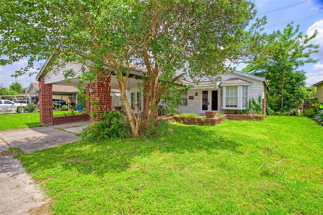 331 Terminal St, Houston, TX 77020 - view of front facade featuring french doors, driveway, a front lawn, and brick siding