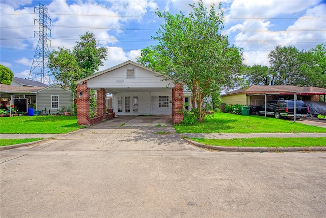 331 Terminal St, Houston, TX 77020 - bungalow featuring brick siding, a front lawn, and aphalt driveway