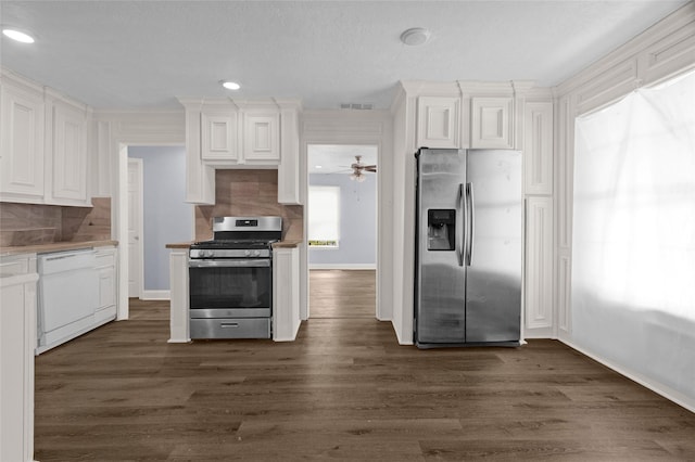 331 Terminal St, Houston, TX 77020 - kitchen with baseboards, stainless steel appliances, white cabinetry, and visible vents